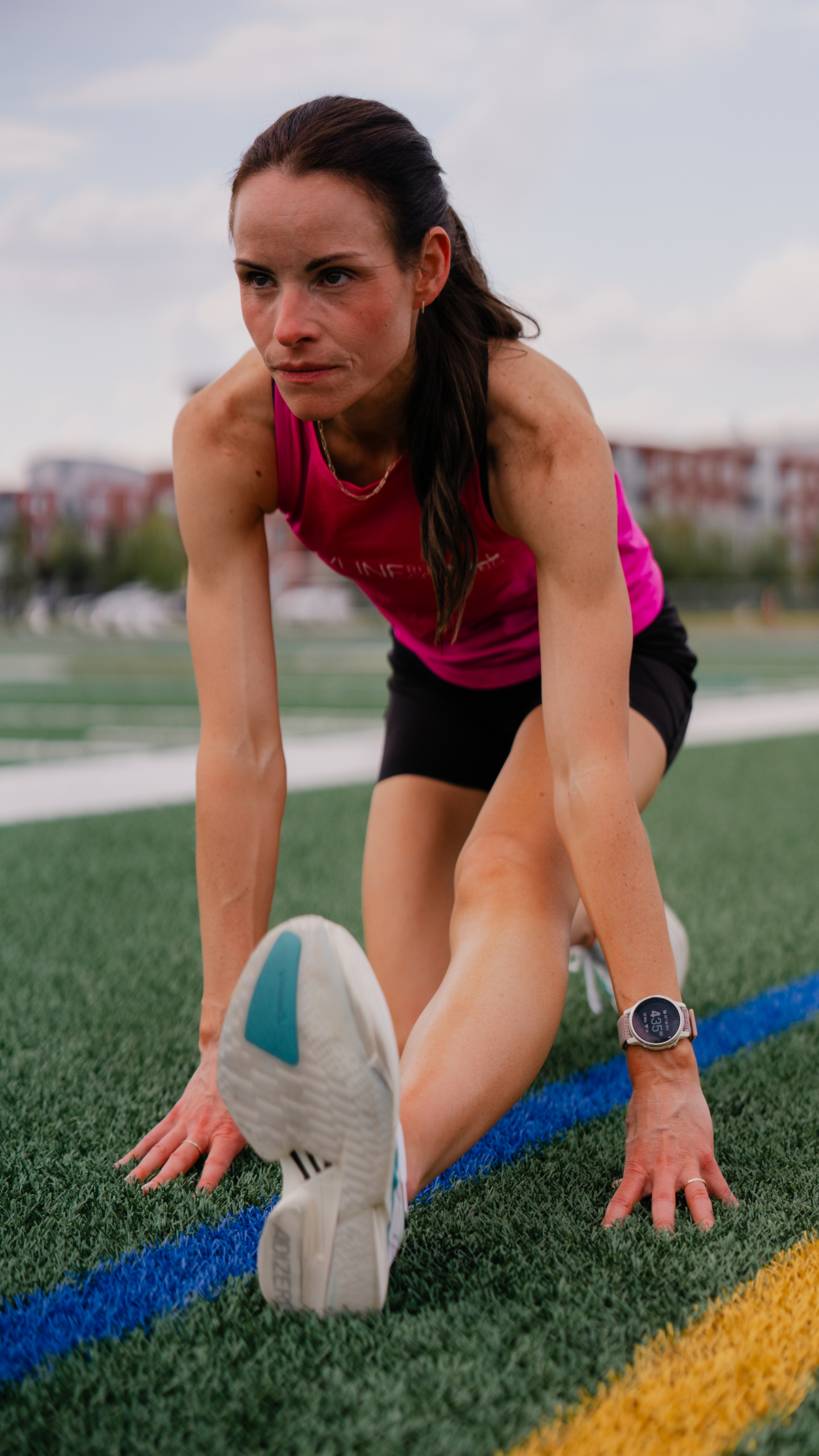 Lynsey stretching on the track
